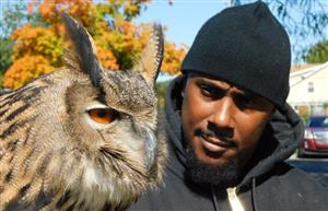 Man holding an Owl